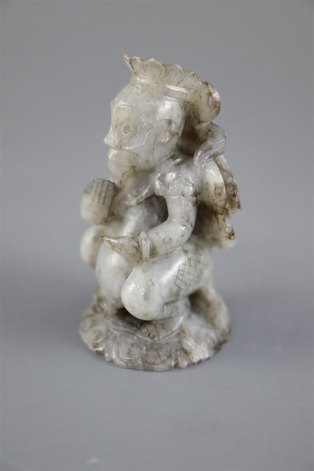 A Chinese grey jade figure, 6.4cm high